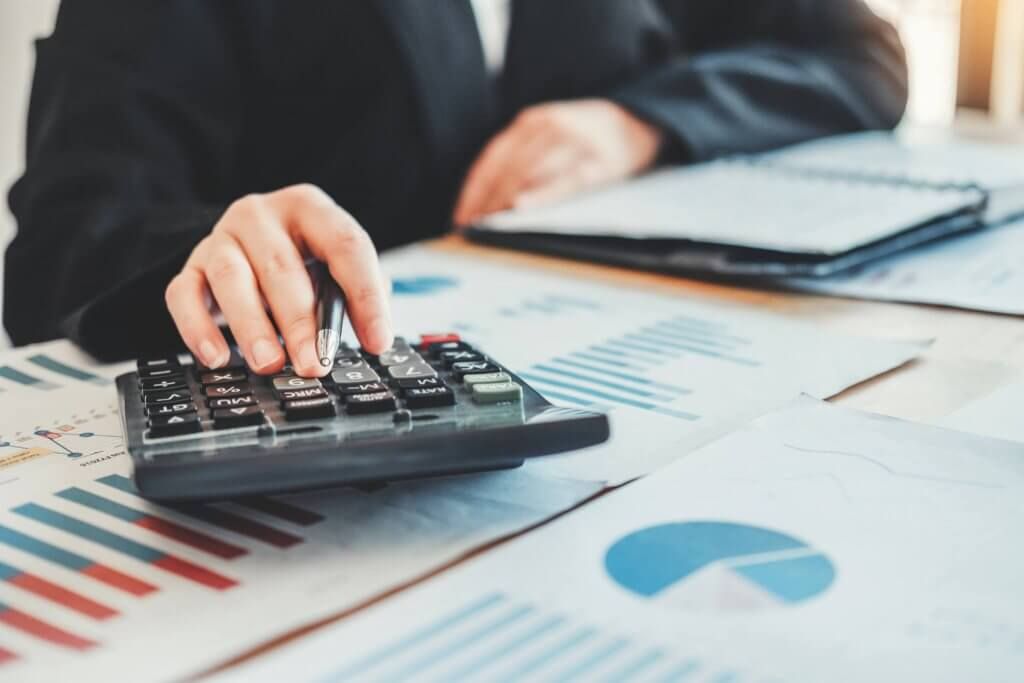 Business woman Accounting Financial investment on calculator Cos Business woman Accounting Financial investment on calculator Cost Economic business and market